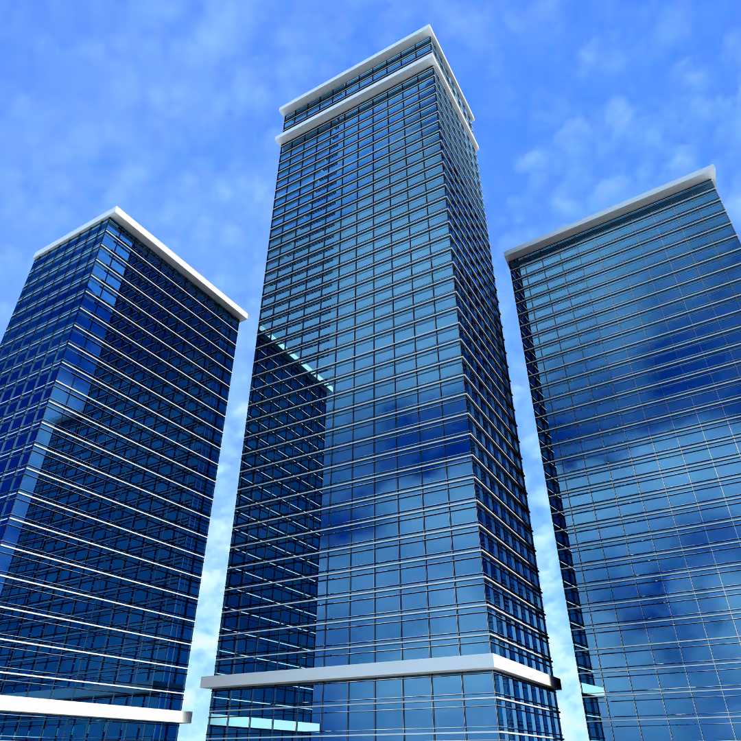 Three modern glass skyscrapers against a blue sky, leading to Reliant’s corporate office coffee service page.