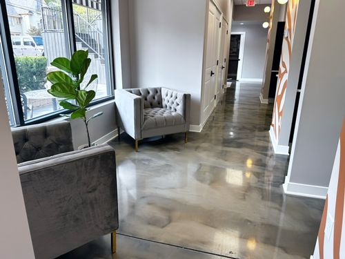 Reception desk at Kutanovski Dental office in Crown Point, Indiana, featuring modern decor and welcoming atmosphere.