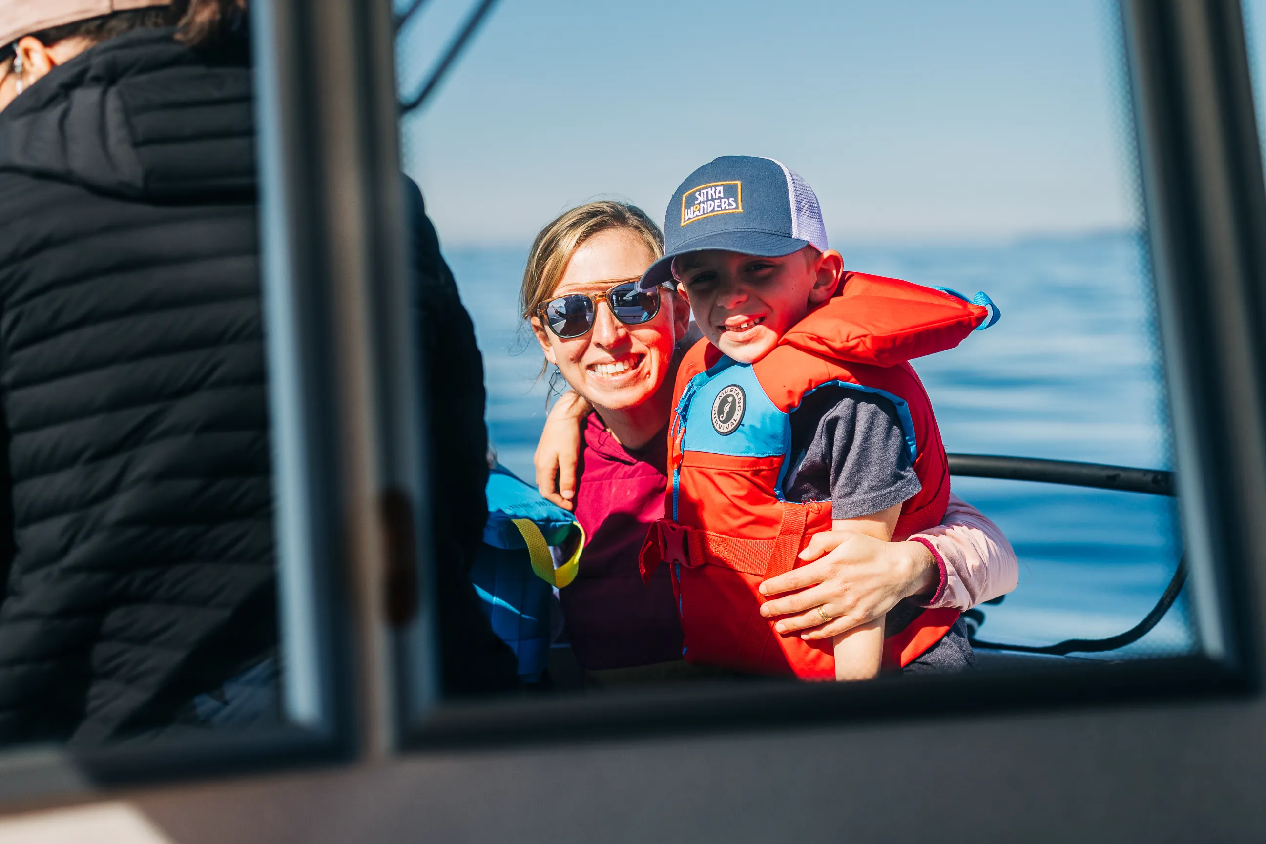 Family on a Sitka Wonders wildlife boat tour at Crescent Harbor, Sitka
