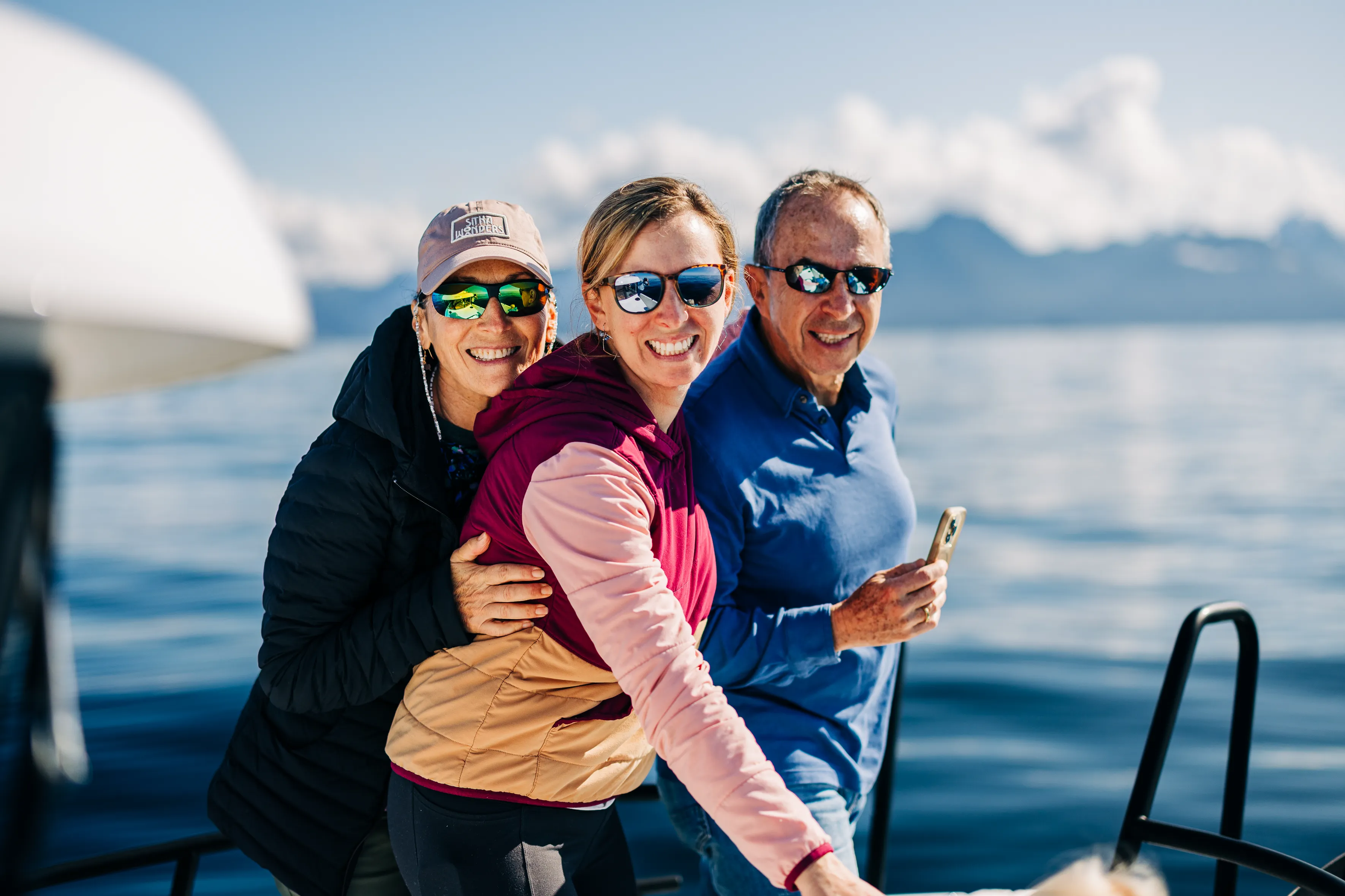 Guests swimming from expedition craft in sheltered cove