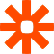 Zapier logo with orange asterisk-like shape and central square.
