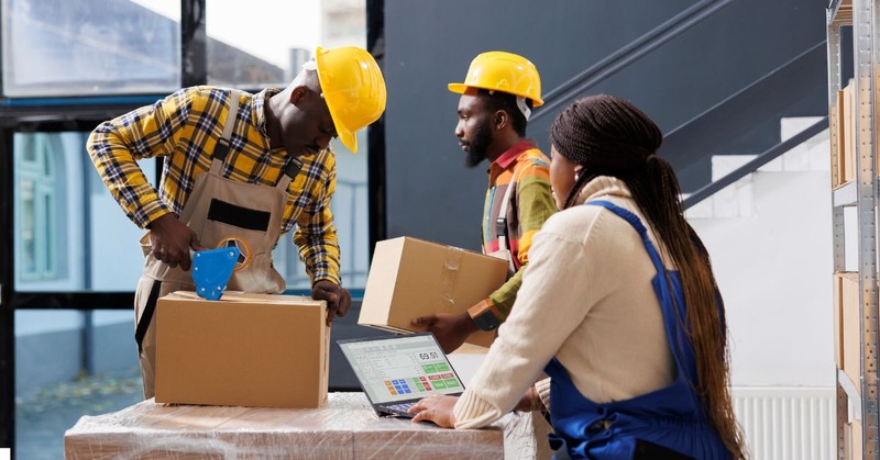 a warehouse worker's packaging and picking orders accordingly