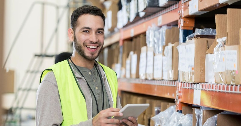 a warehouse employee that's smiling