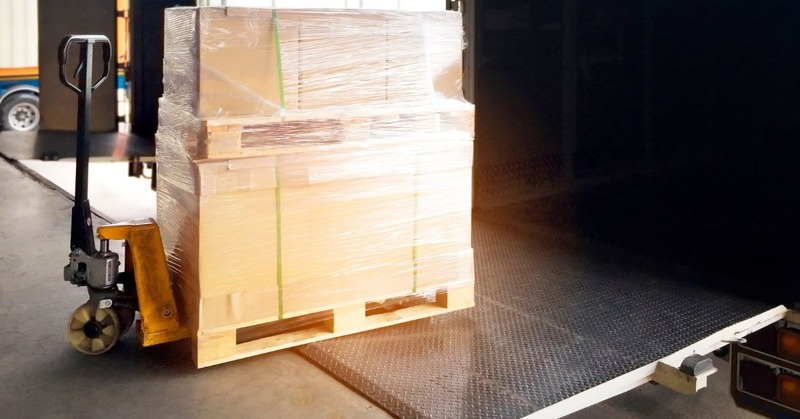 a pallet being moved into a truck