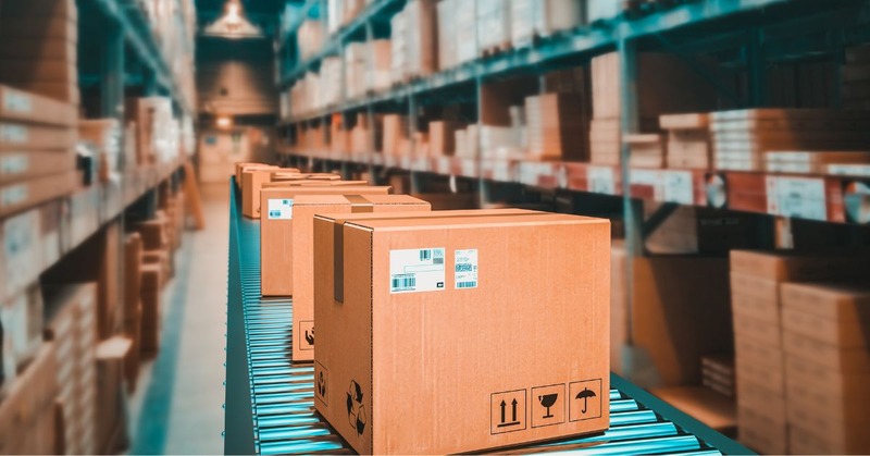 a bunch of boxes on a warehouse conveyor belt