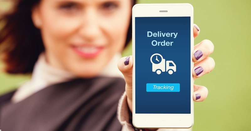 a woman showing her phone screen with delivery tracking