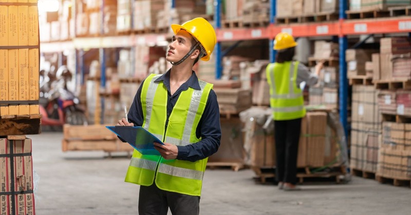 a warehouse worker checking the storage