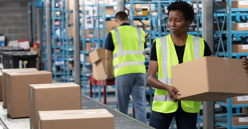 a warehouse worker holding a box