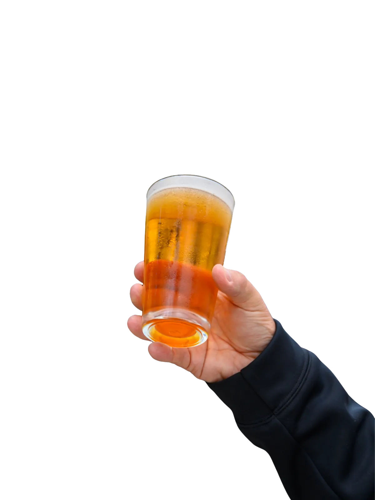A man holding up and pint of beer.