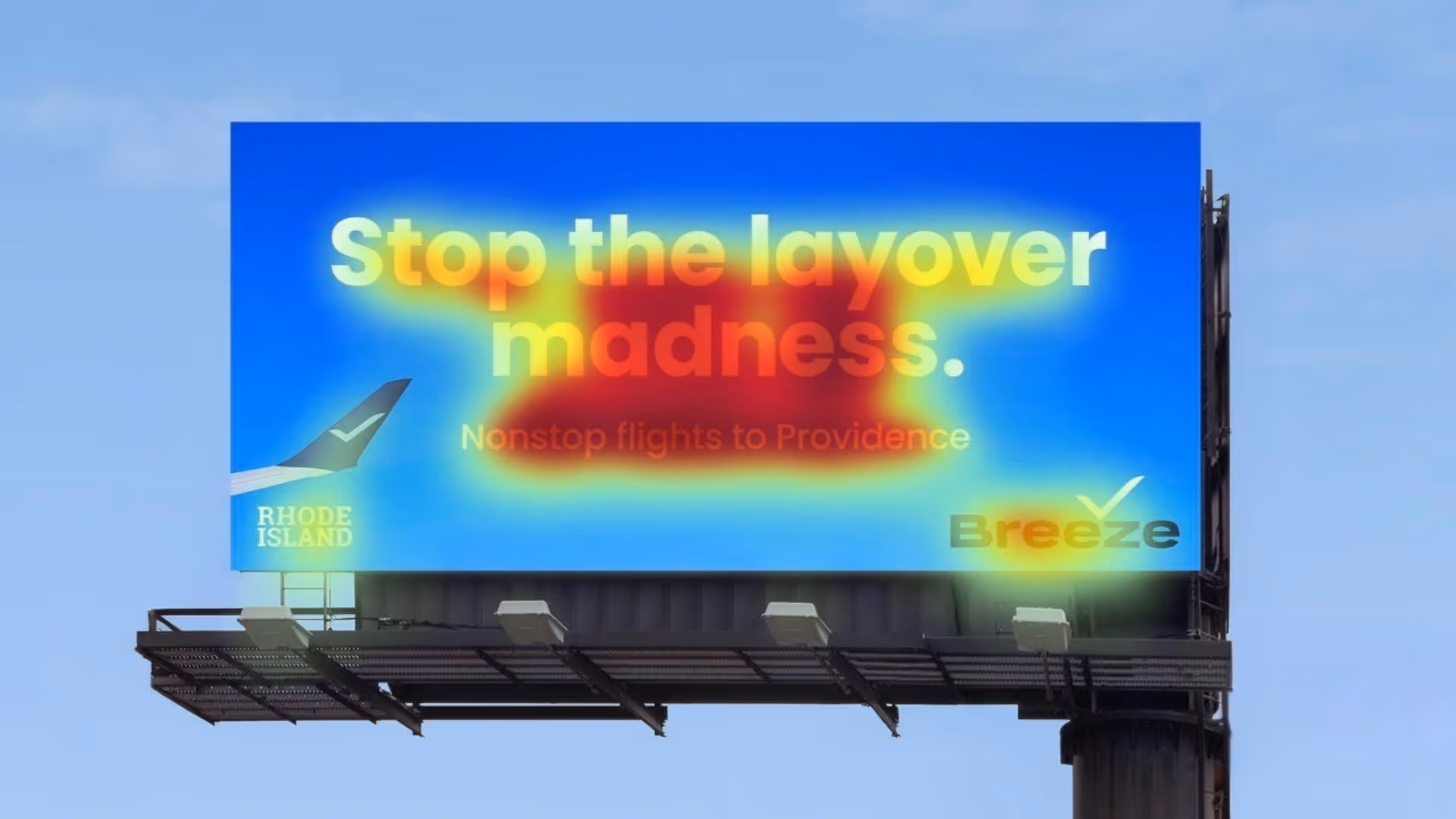 Heatmap analysis of Breeze Airways billboard reading ‘Stop the layover madness. Nonstop flights to Providence,’ showing strong viewer attention on the main slogan and airline logo.