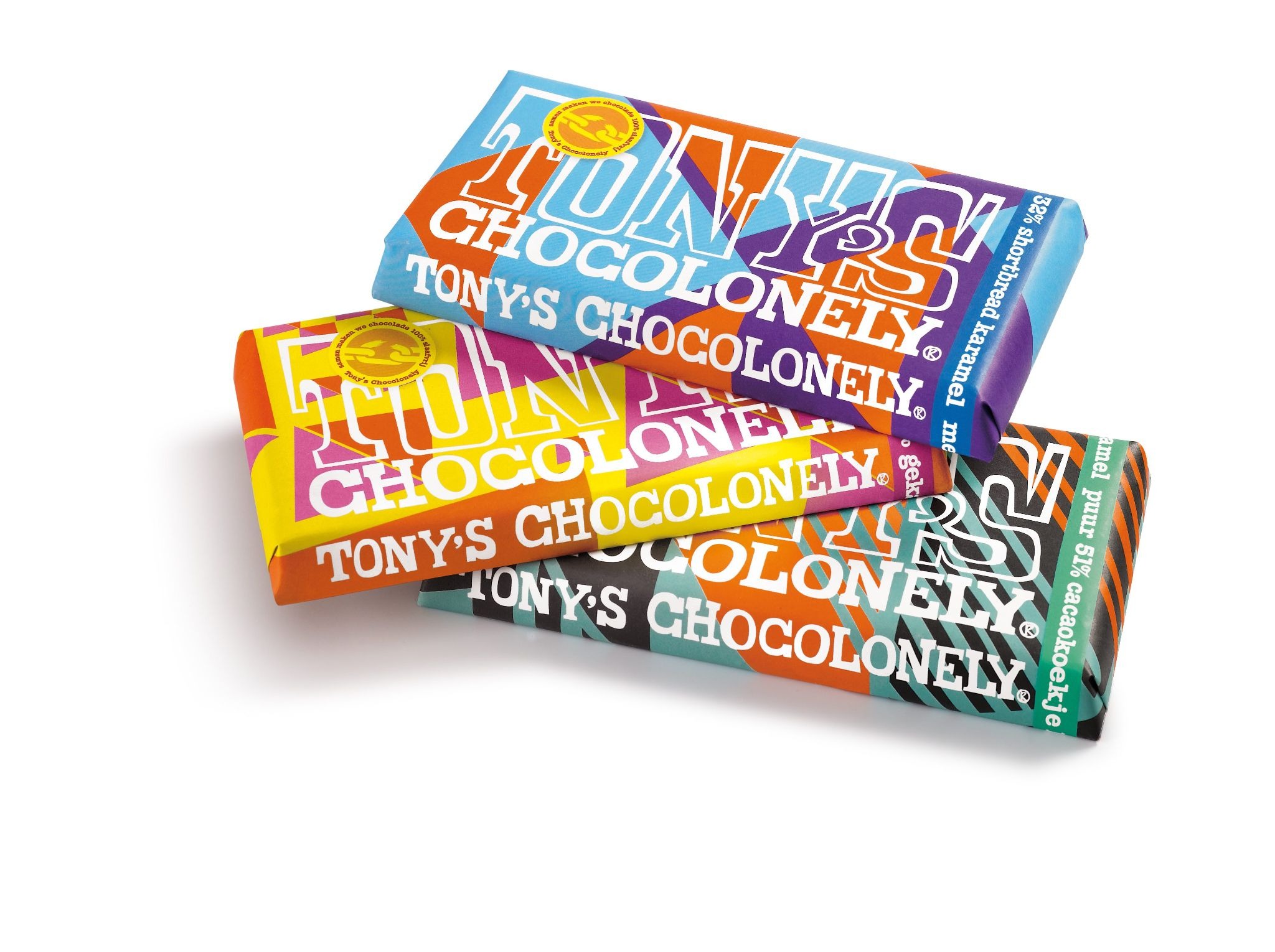 Three Tony's Chocolonely chocolate bars in distinctive color-block packaging (blue, yellow, orange). The unmissable wrapper design is a salience asset that triggers brand recognition before any text is read.