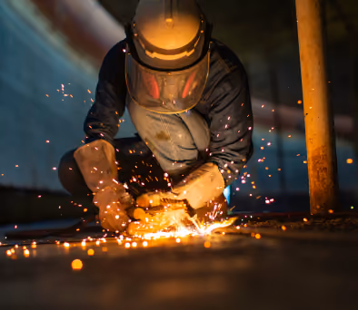 A sheet metal worker doing welding