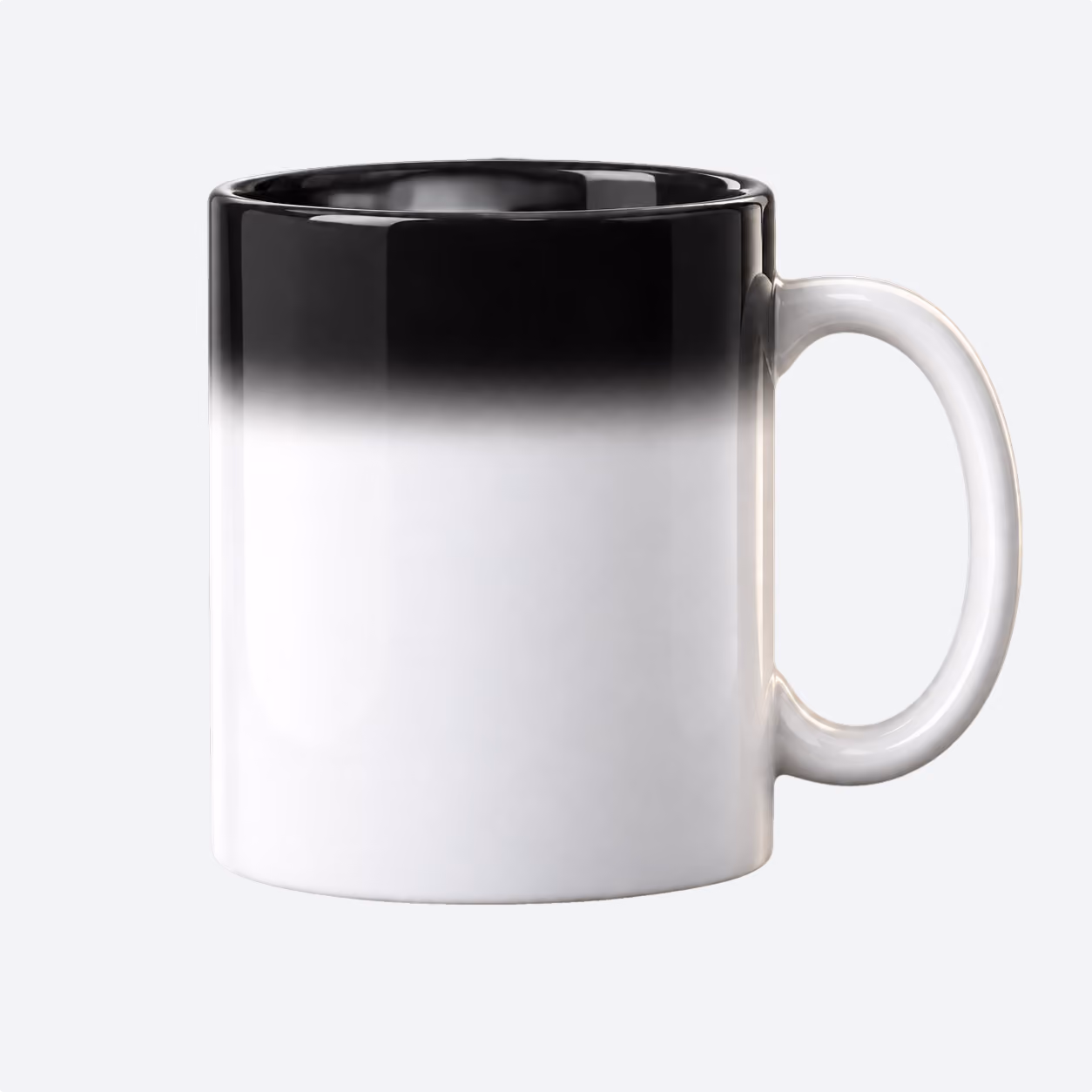 Ceramic mug with a gradient design transitioning from black at the top to white at the bottom with a white handle.