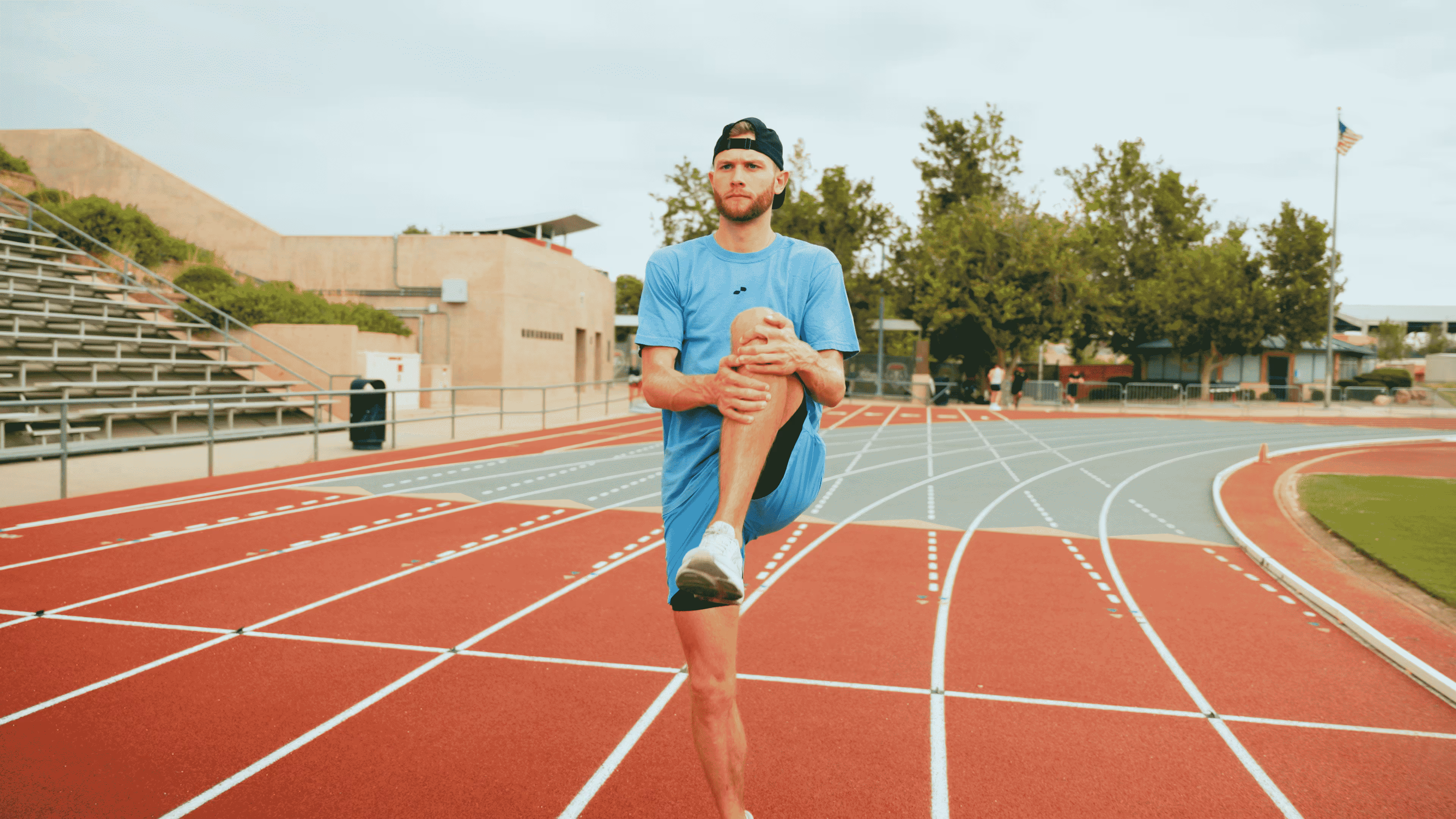 Man Stretching - Standing Quad Stretch
