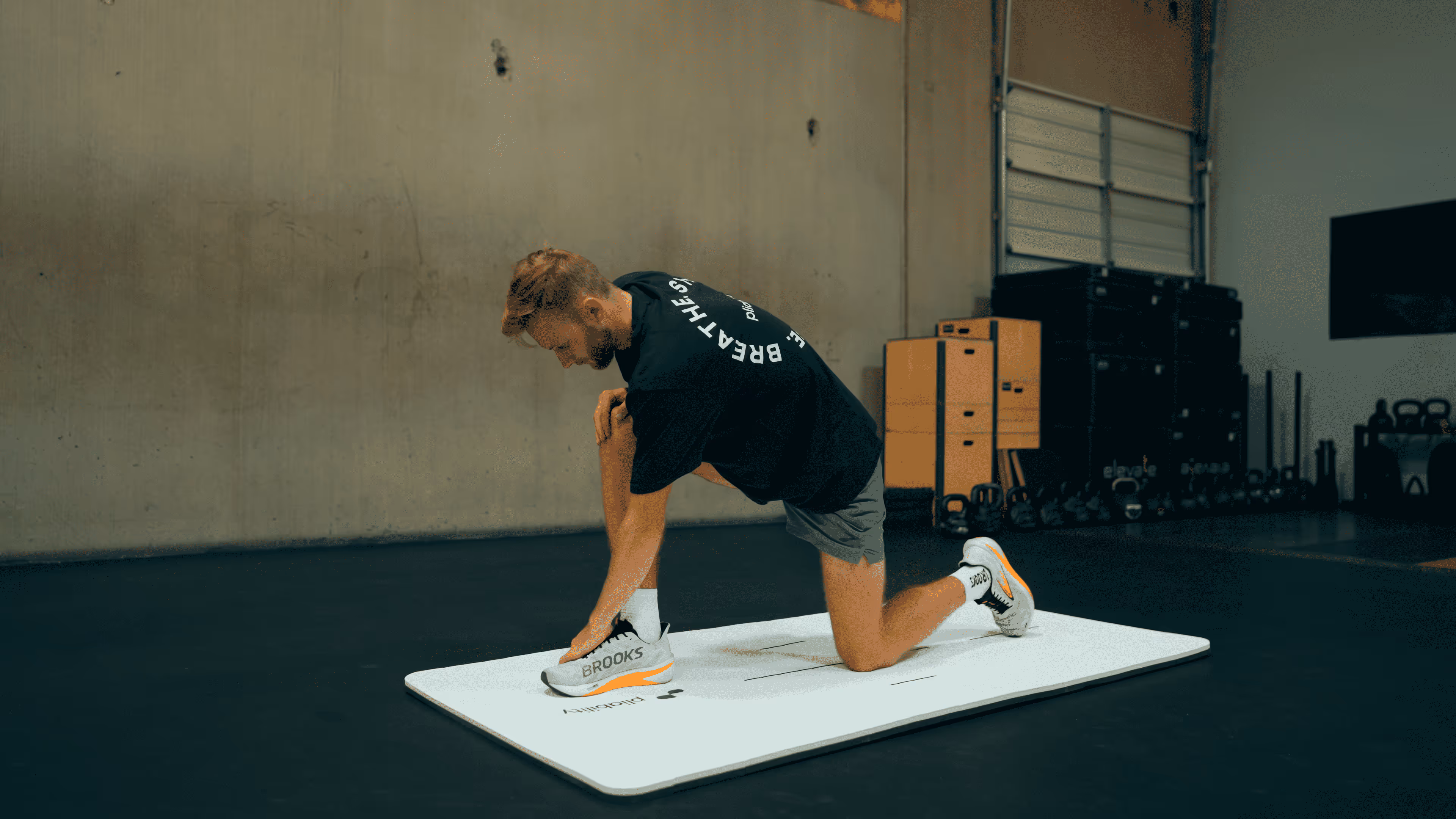 man trying to stretch - What Is the Best Strategy to Improve Flexibility in Your Legs and Back?