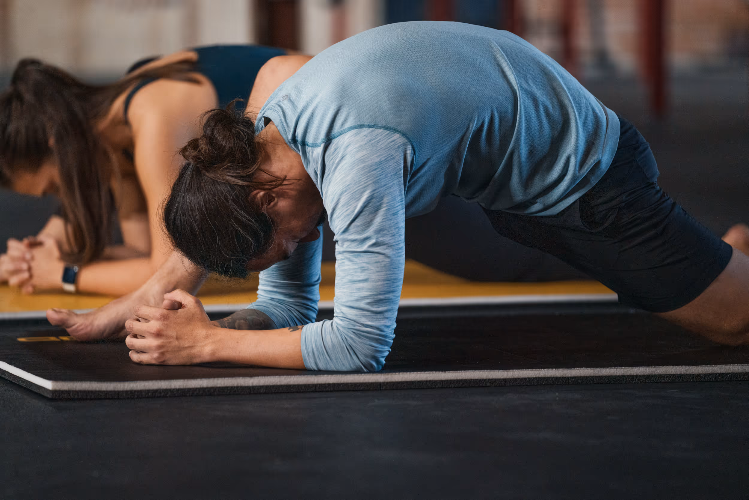 man in plank position - How to Engage Employees in Wellness Programs