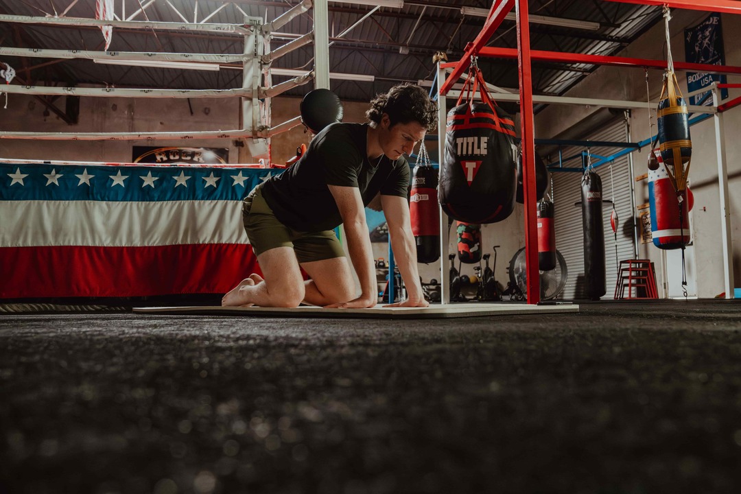 man trying to stretch - Best Peptides for Athletic Performance
