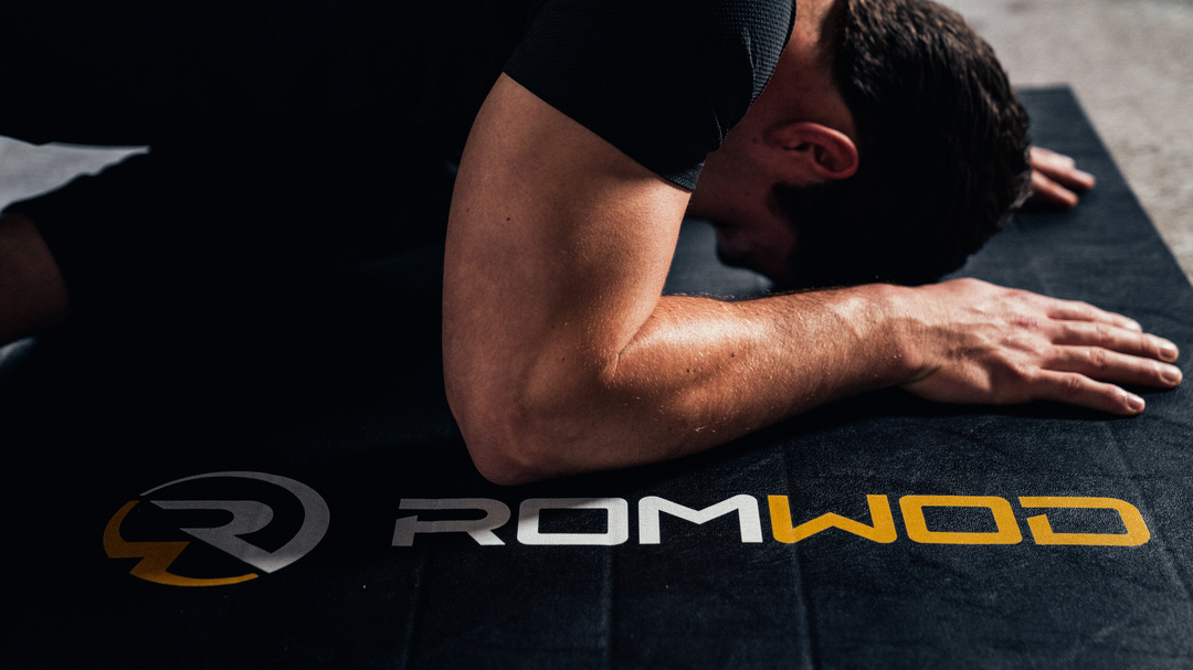 man on mat - Why Can’t I Straighten My Arm After Working Out