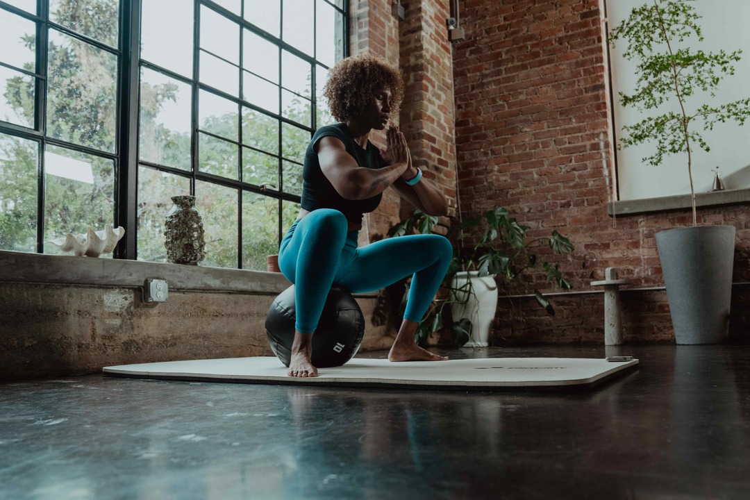 woman sitting on a ball - Bend App Cost