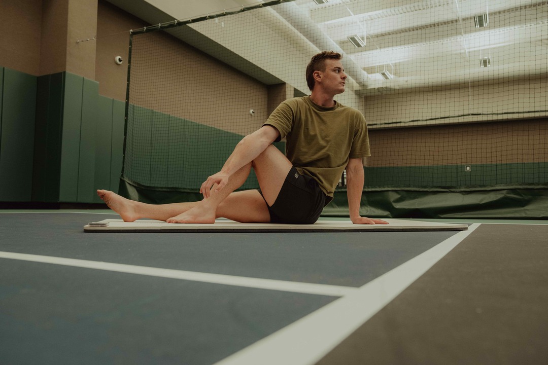 man in tennis court - Best Recovery Tools for Athletes