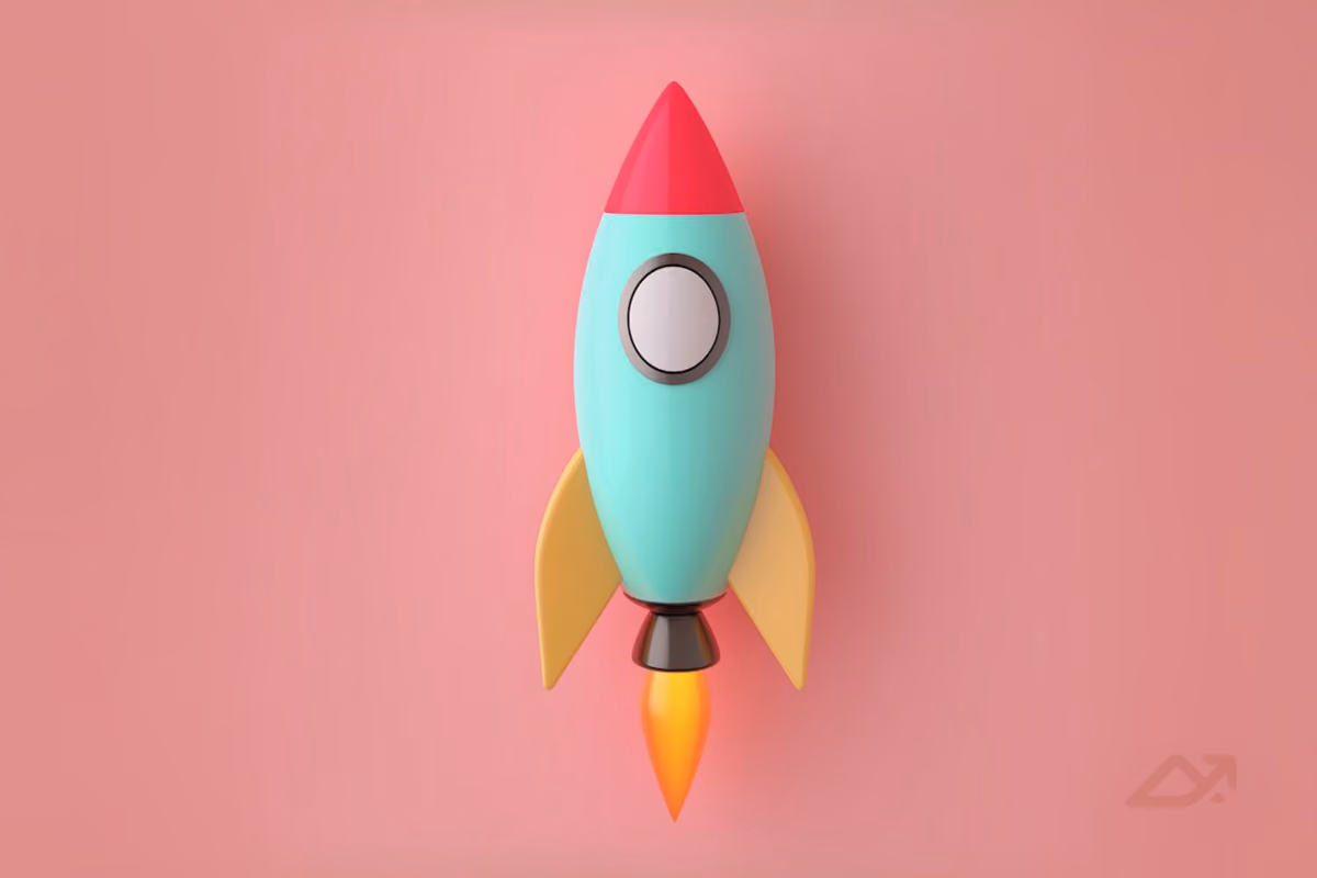 Colorful rocketship on pink background