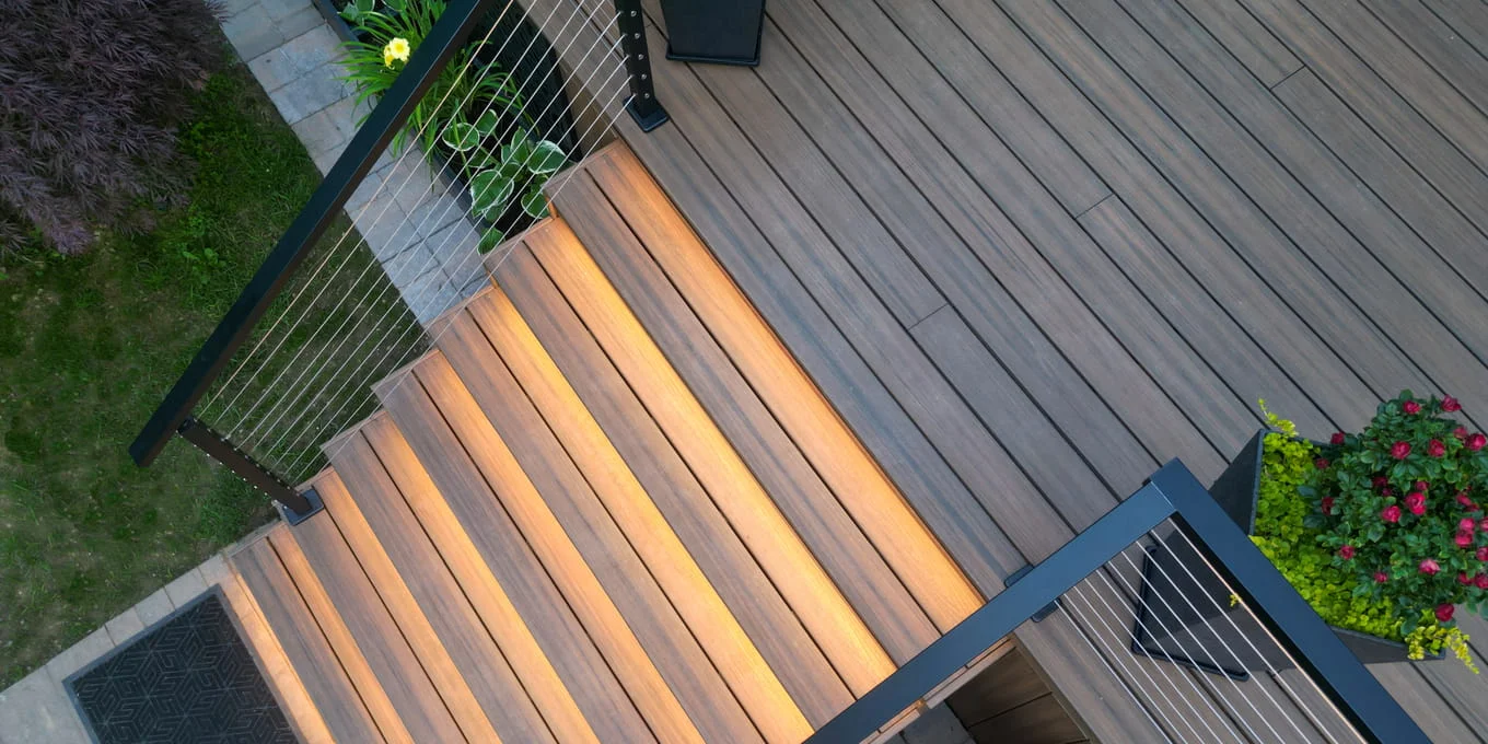 Composite deck stairs with LED riser lighting and black cable railing, seen from overhead