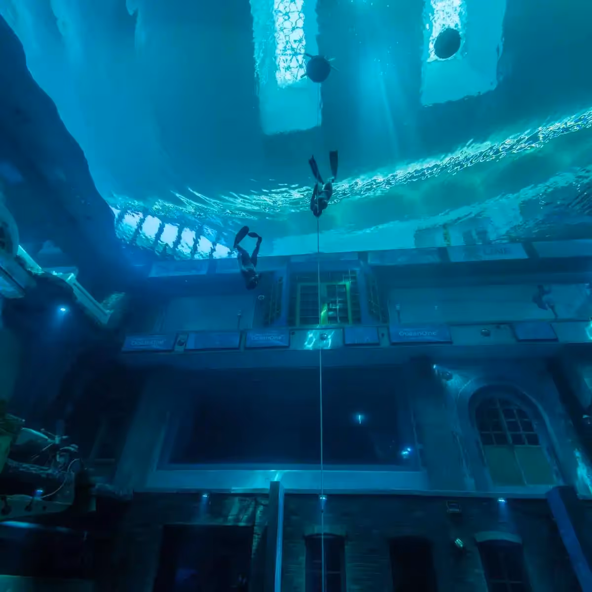 people scuba divers in a building