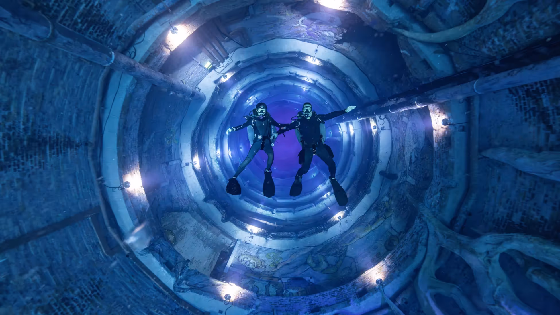 people scuba divers in a tunnel