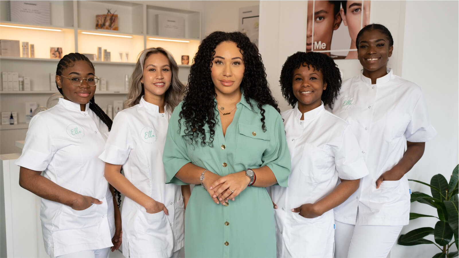 The team at Ella Clinics, including Richenna, Ella, Tavonda, and Shannaïs, standing together in their clinic, showcasing a welcoming and professional environment.