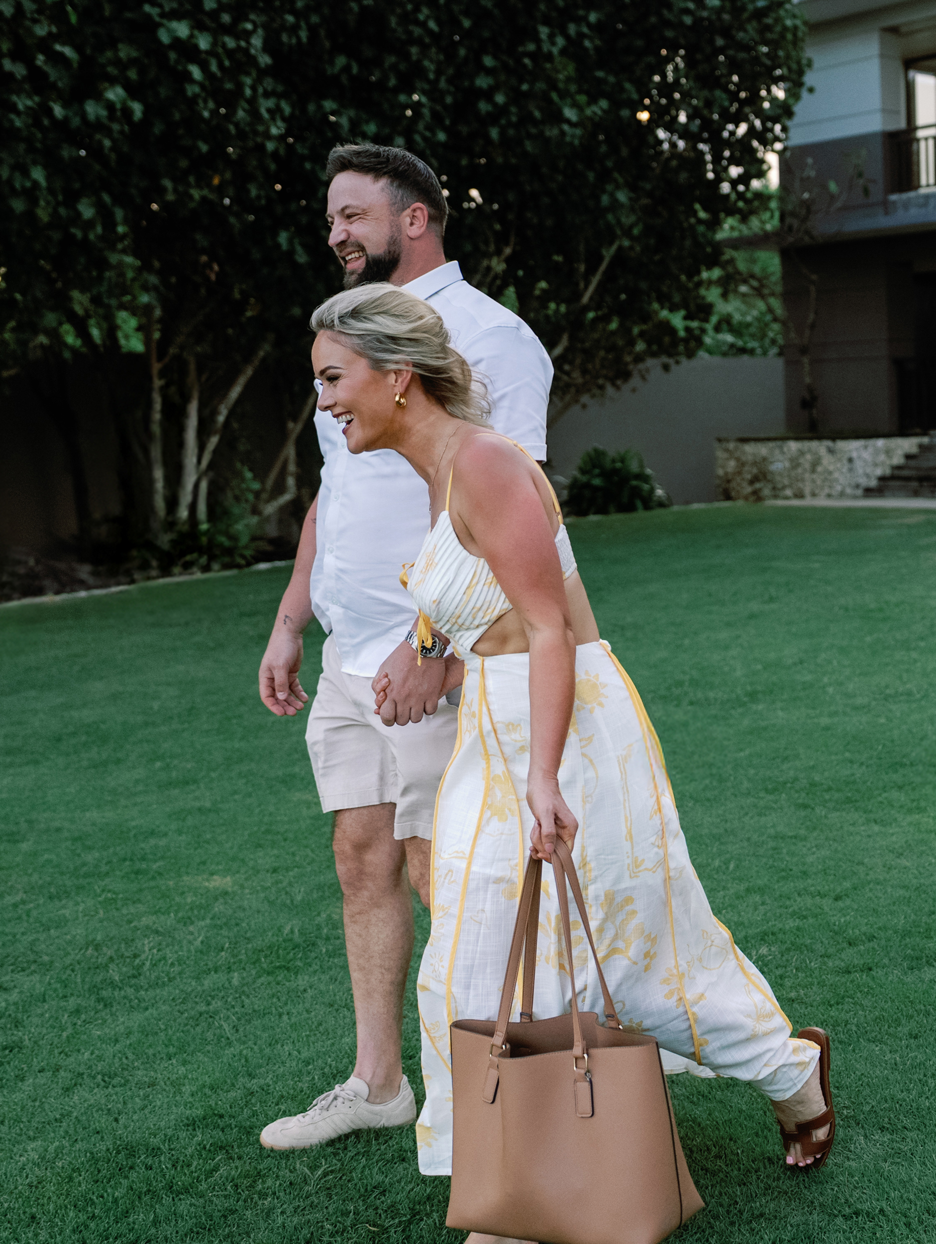 Custom luxury floral proposal arch set up on a secluded Bali cliffside.