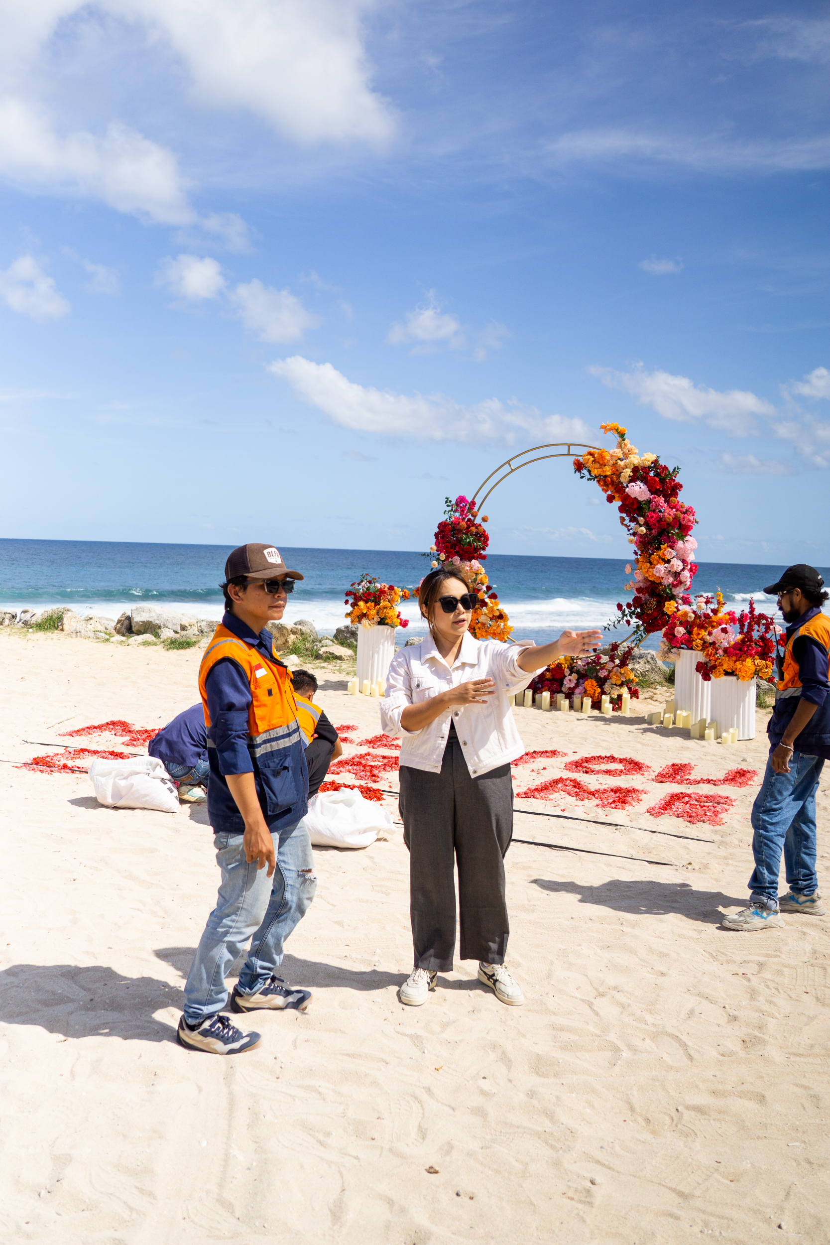 Groom and bride-to-be standing next to a private chartered helicopter in Bali.