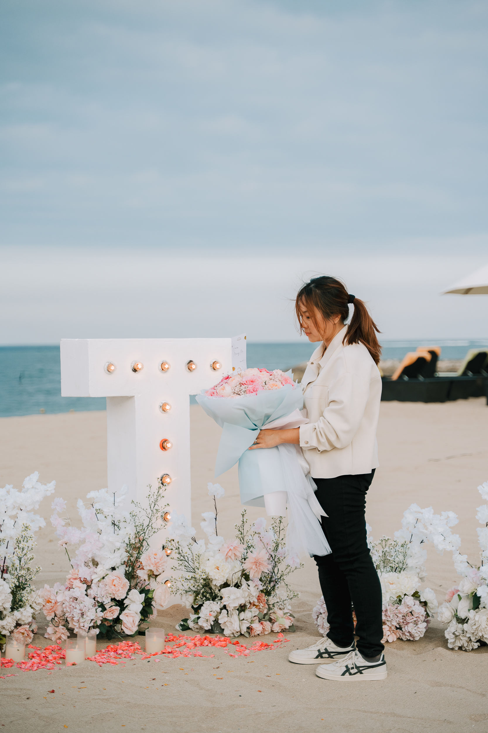 Groom and bride-to-be standing next to a private chartered helicopter in Bali.