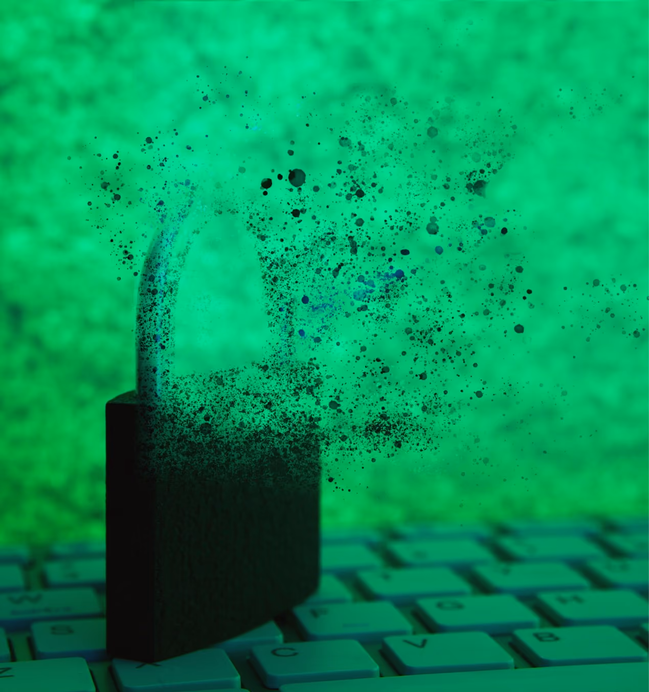A black padlock on a computer keyboard appears to be unlocking and disintegrating into small particles against a green background.