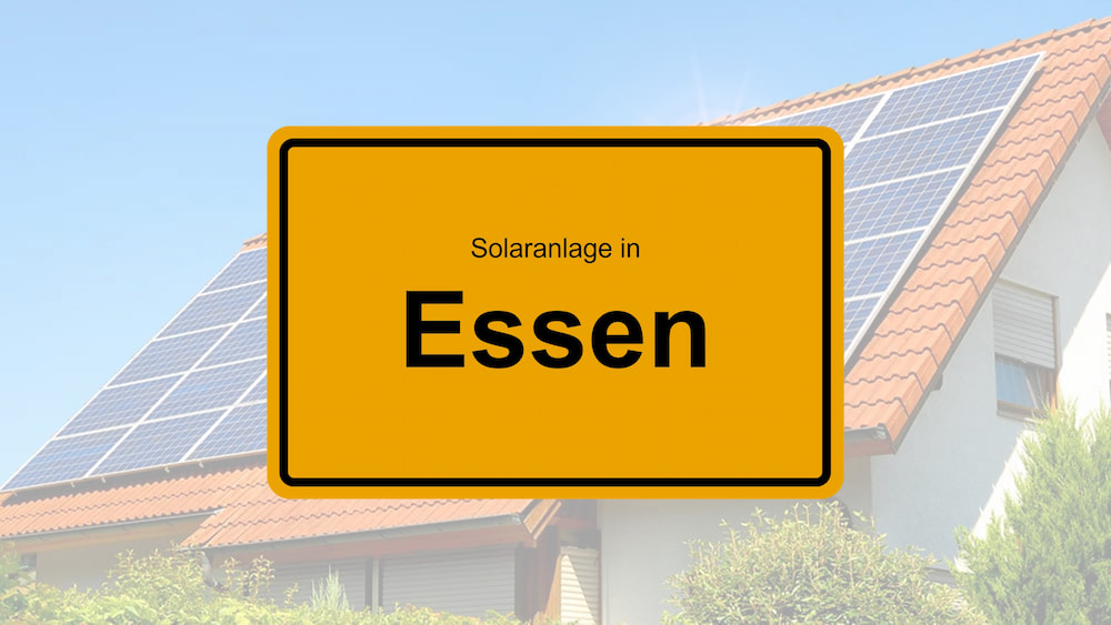 Ortsschild Essen mit Solarhaus im Hintergrund