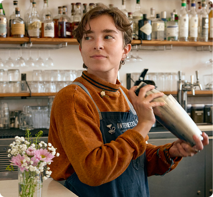 Bartender shaking a cocktail at a cocktail bar