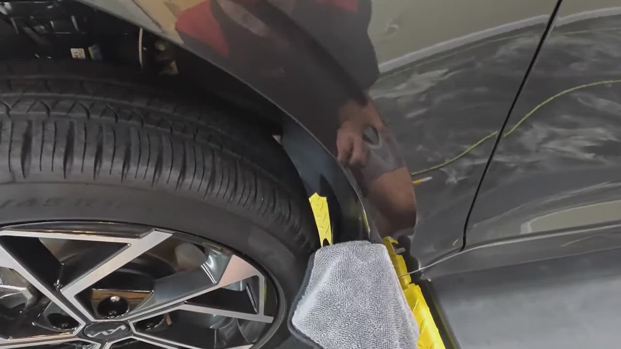 Protection film being fitted near a front wheel