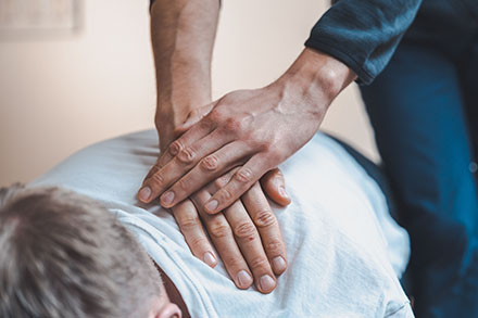 A person receiving chiropractic care