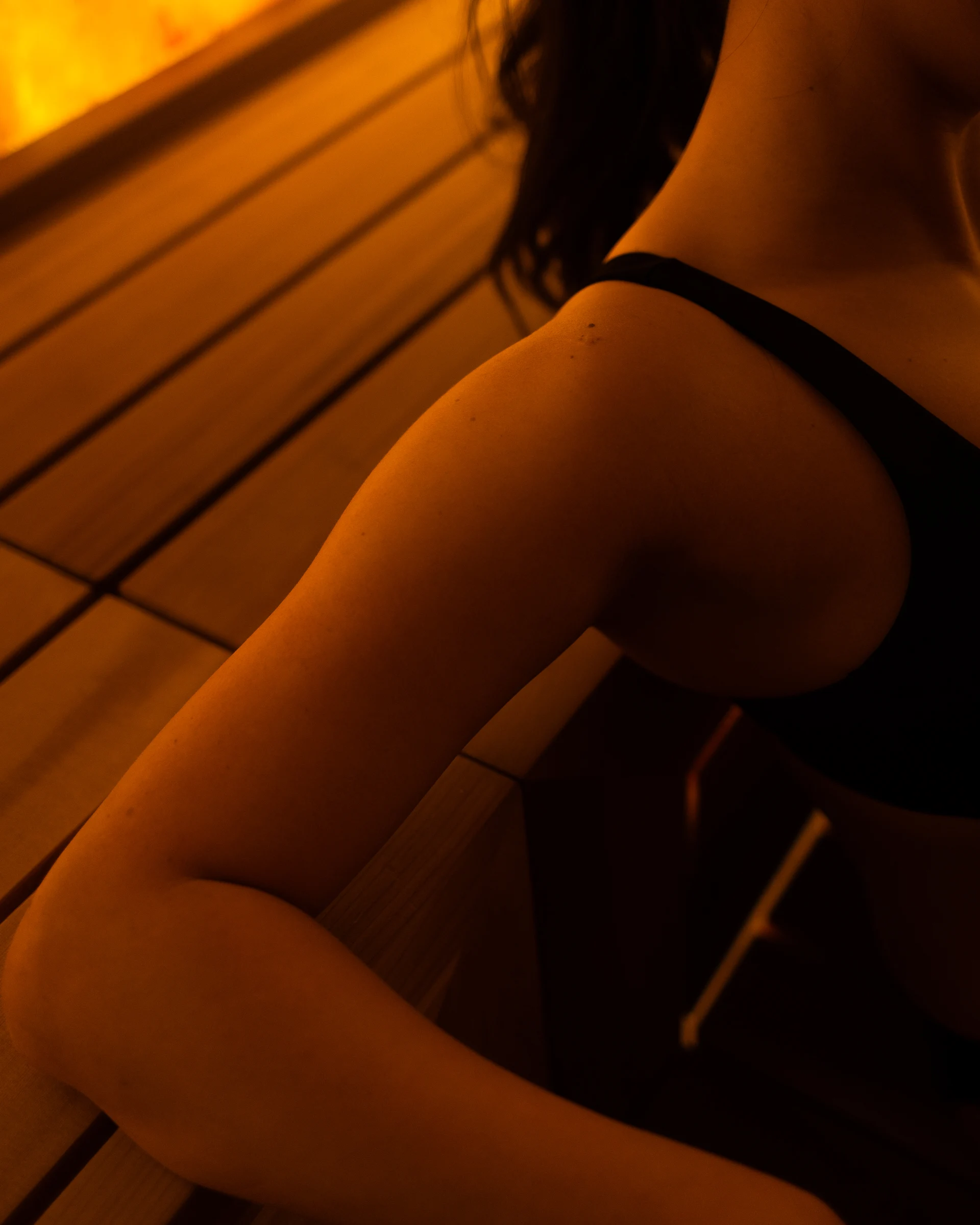 Close-up view of Vancouver sauna architecture at Aetherhaus, highlighting the natural wood textures and warm lighting