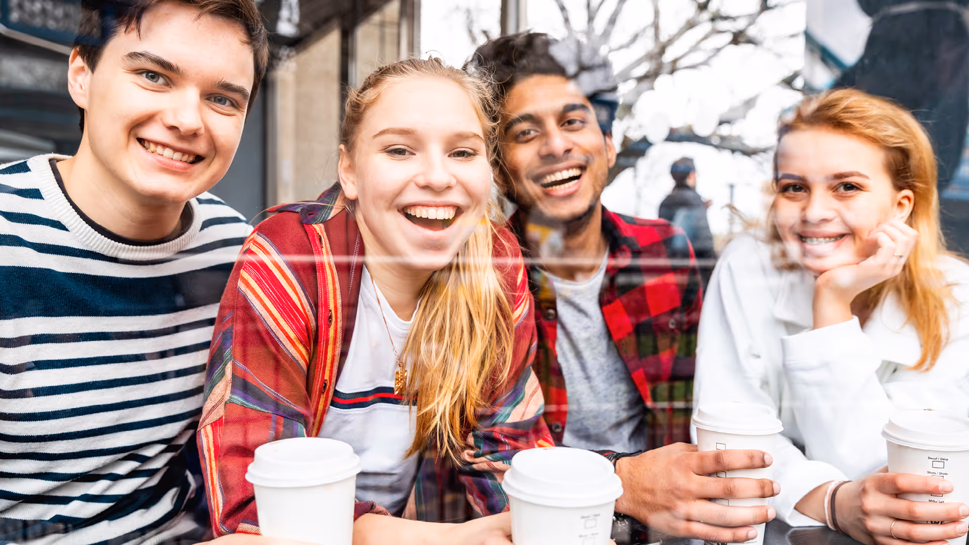 Group of friends with takeaway coffee cups