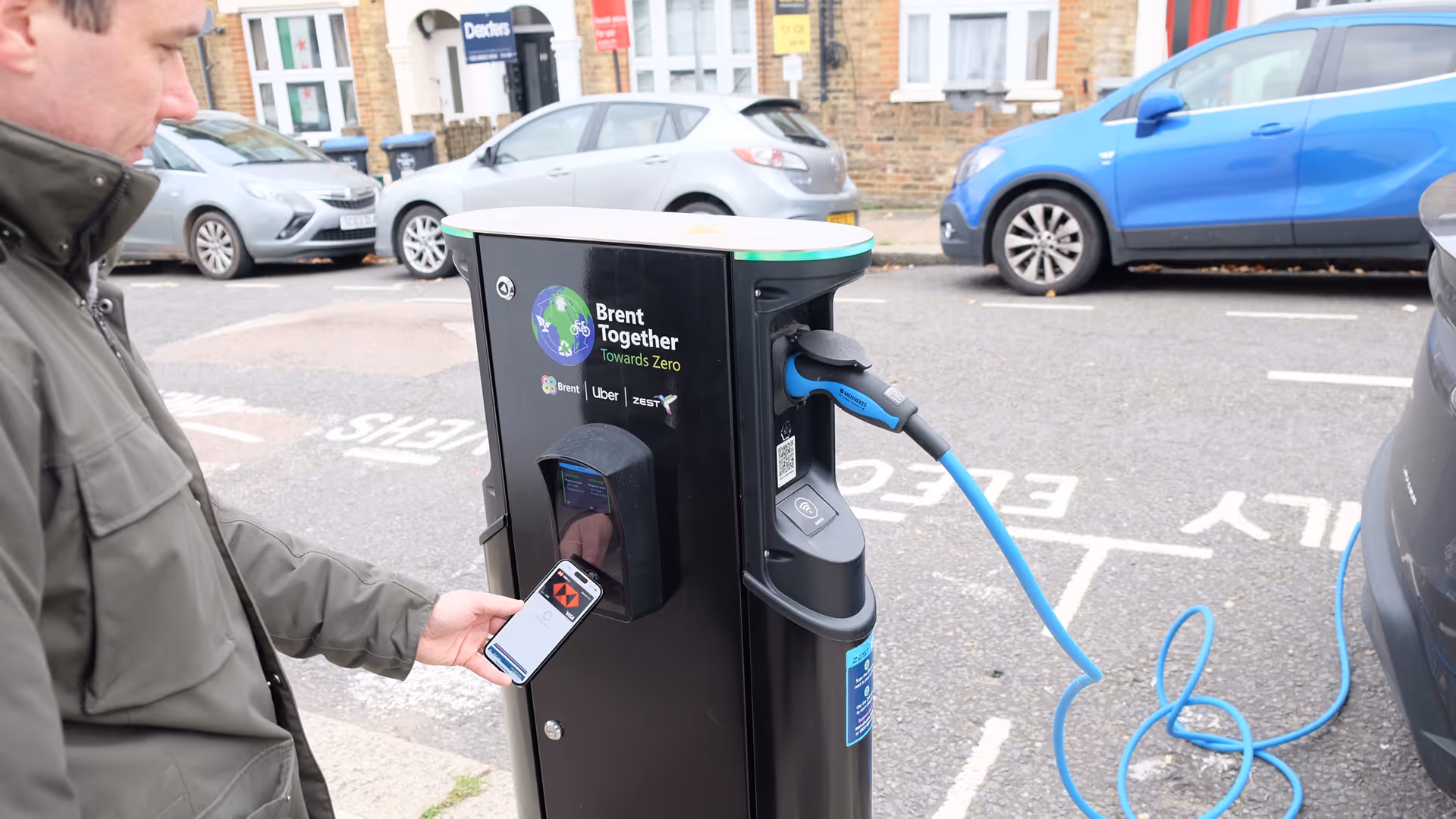 Person using apple pay on a Brent Council charger