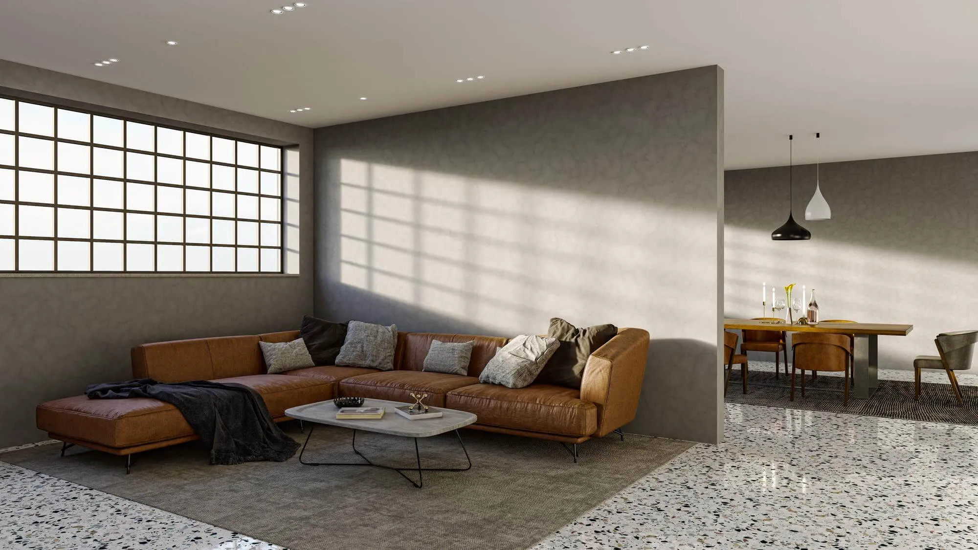 A living room with a couch and a table.