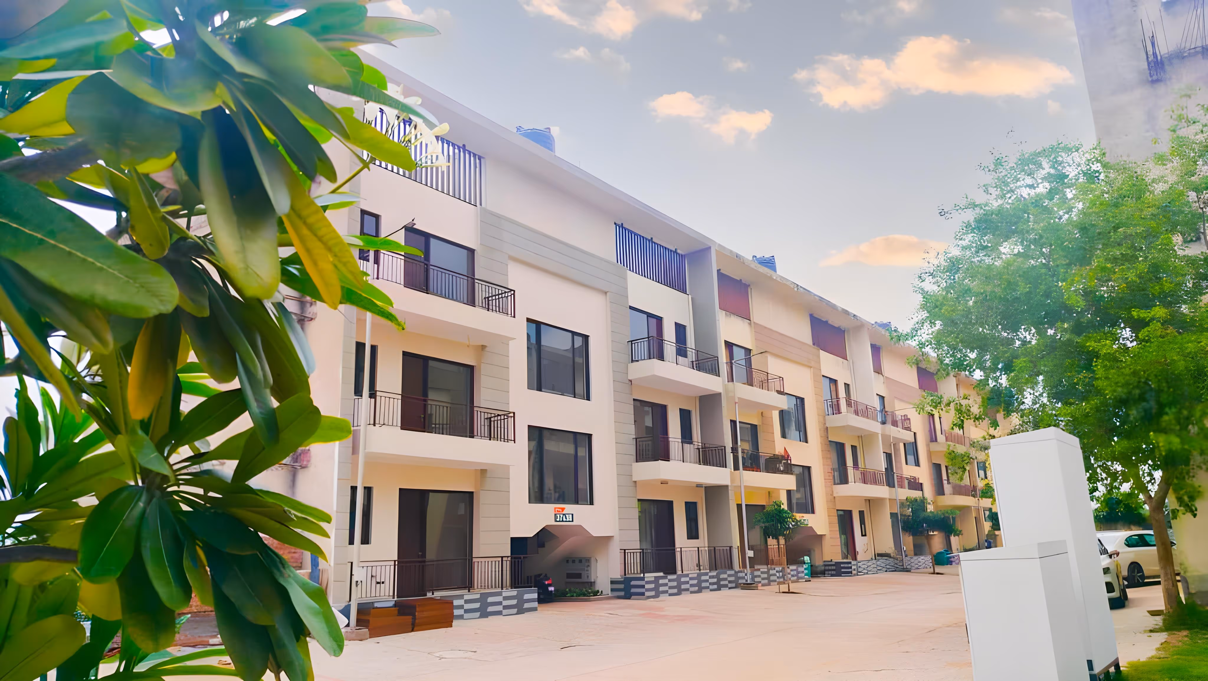 A large white building with many balconies.
