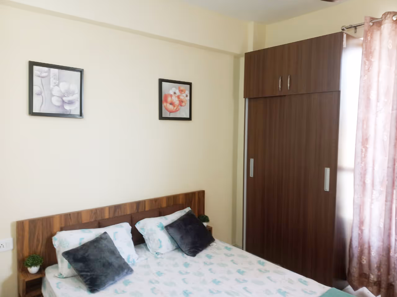 A bed sitting in a bedroom next to a window.