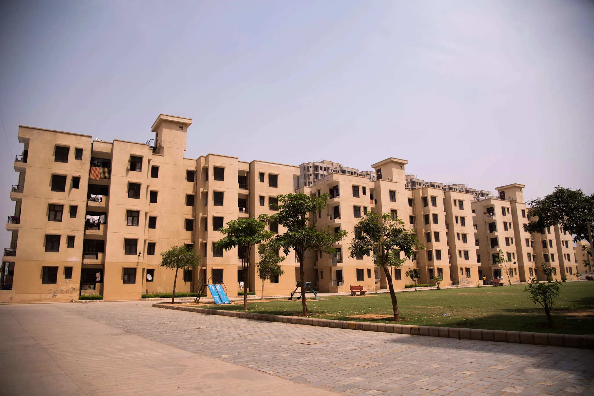 A large building with a lawn in front of it.