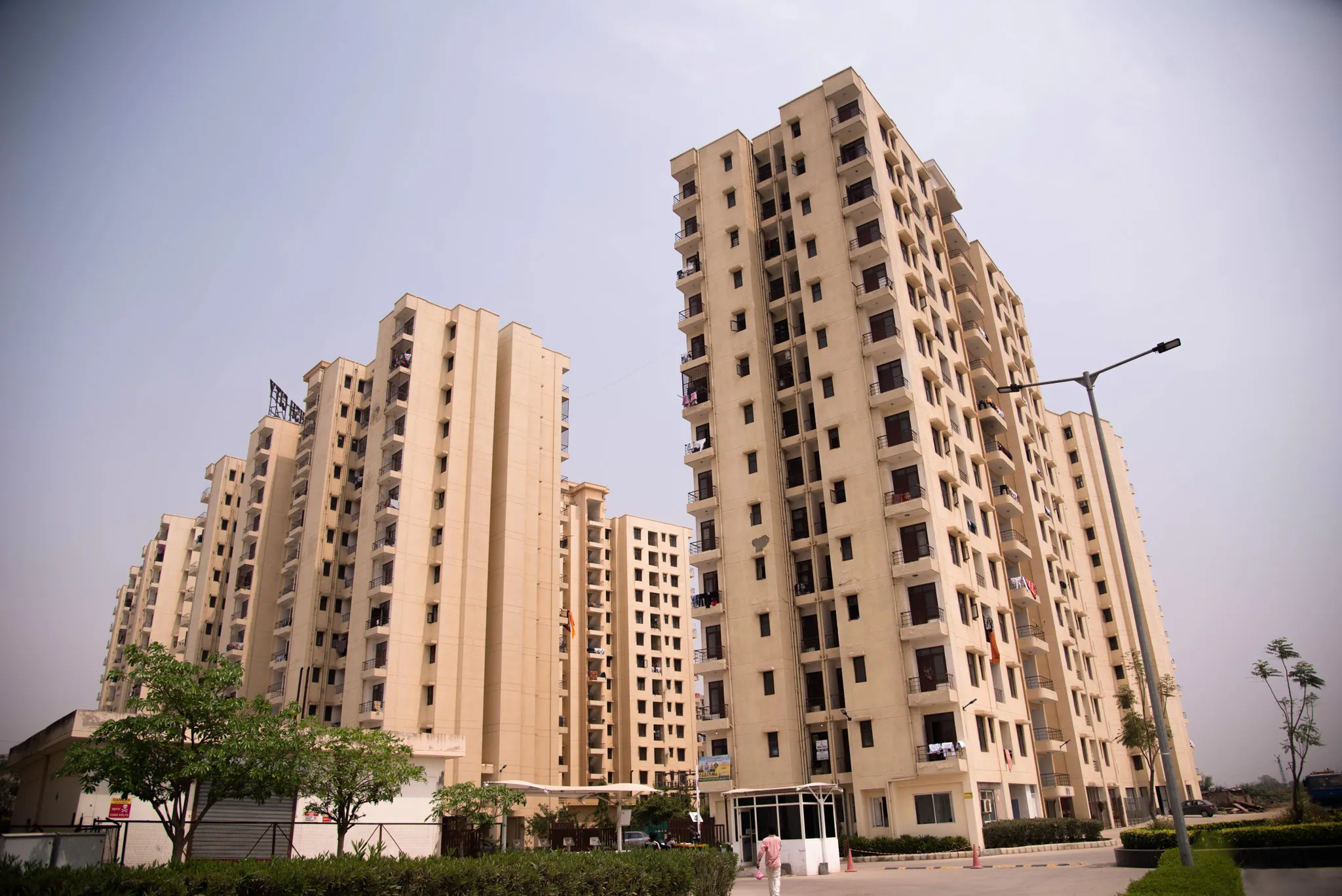 A couple of tall buildings sitting next to each other.