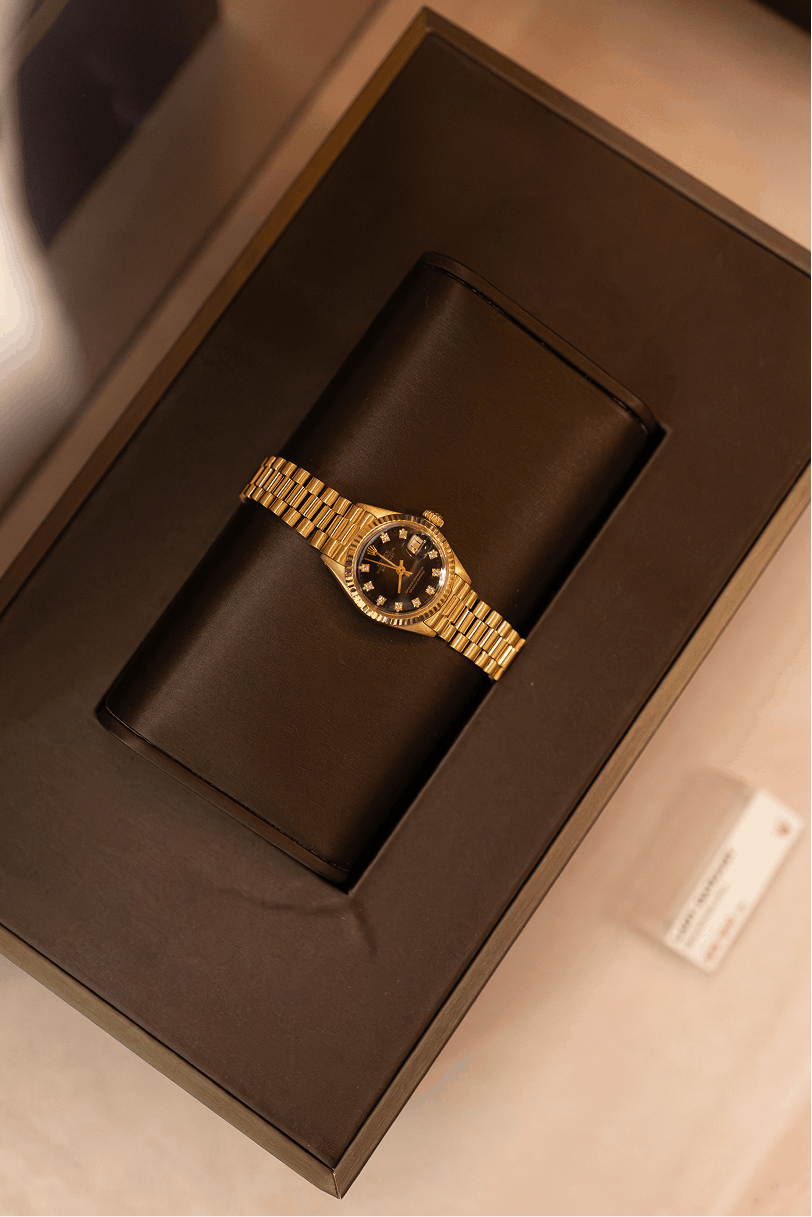 Close-up of a watch dial on display at Le Bohemian
