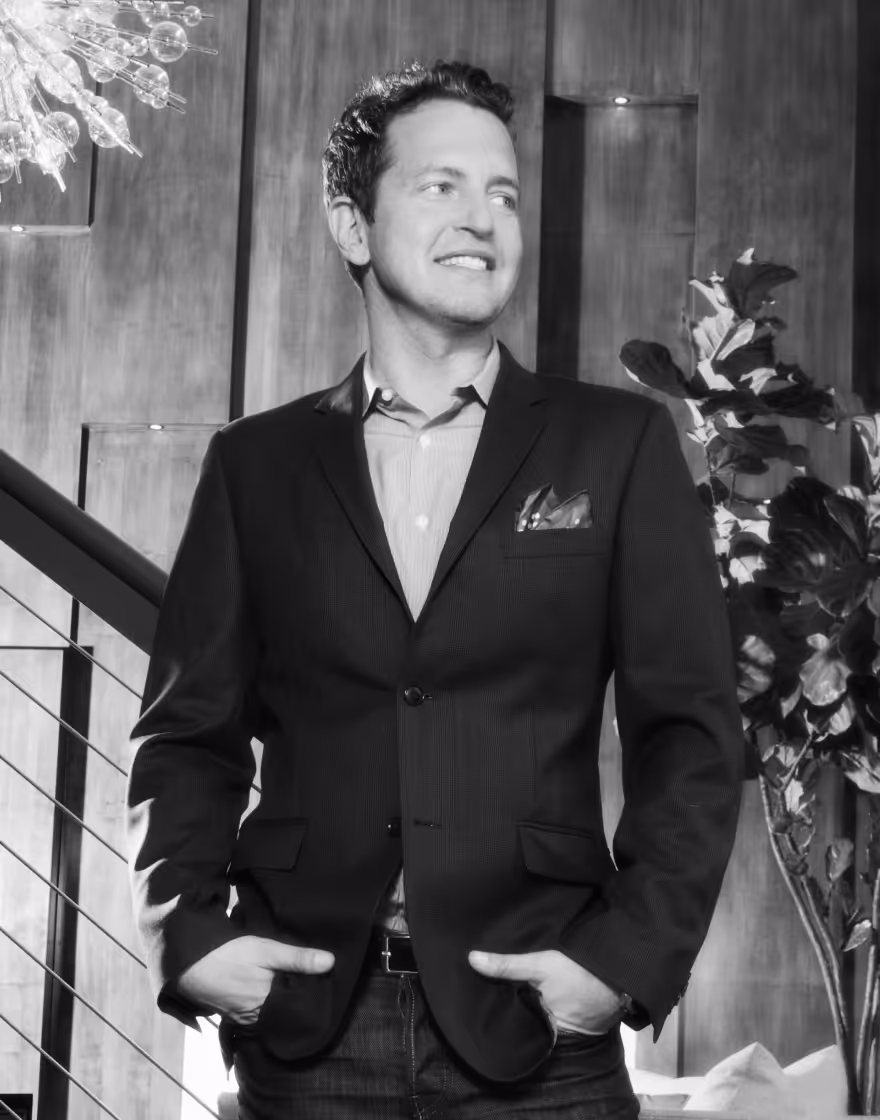 Image of Mark Brunetz posing next to stairs.