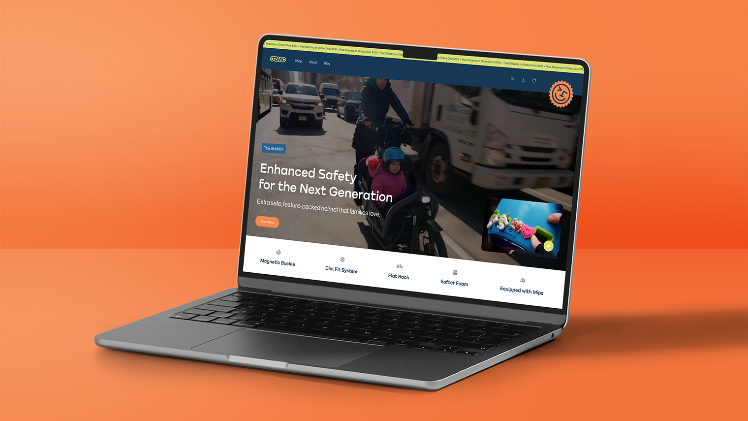 Ozmo website displayed on a laptop featuring enhanced safety helmets for kids and families.