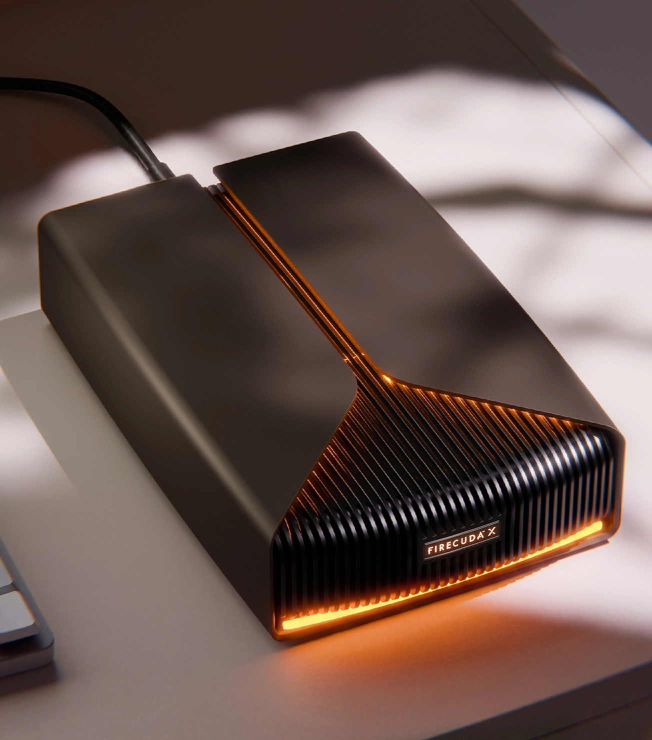 FireCuda X external gaming hard drive connected by USB-C cable.