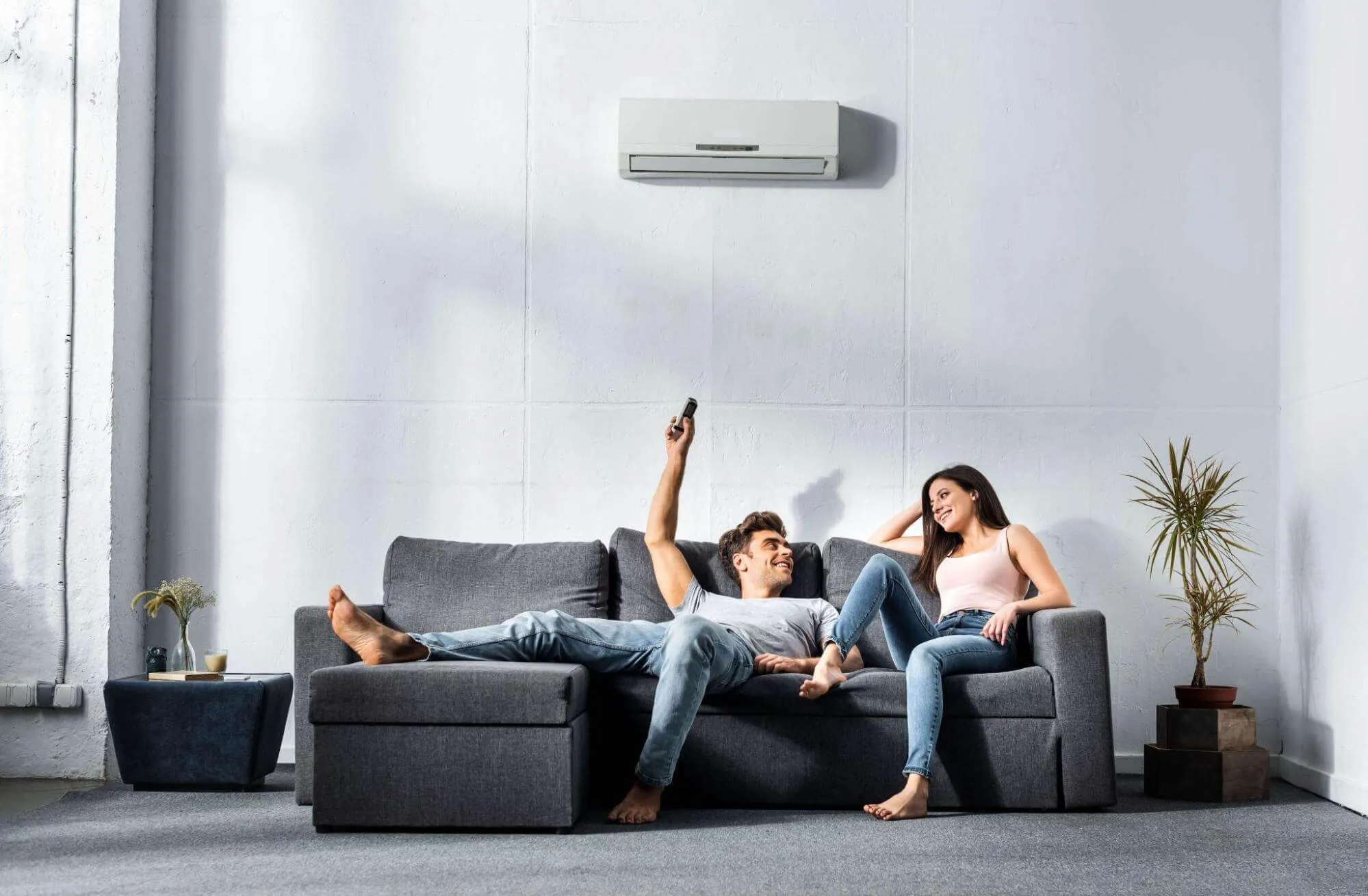 Couple relaxing at home with air conditioning